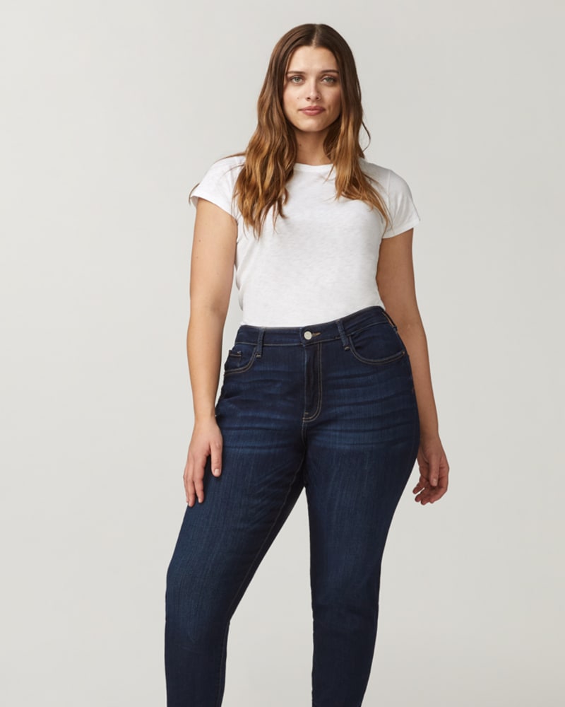 Front of a model wearing a size 14 Jennifer Skinny Jean in Dark Wash by Warp + Weft. | dia_product_style_image_id:232667